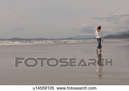 Young girl walking on beach, Pacific Rim National Park, Vancouver Island, Canada View Large Photo Image Stock Photography - Young girl walking on beach, Pacific Rim National Park, Vancouver Island, Canada. Fotosearch
