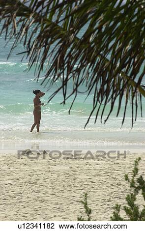 Young woman on the beach in Mexico View Large Photo Image Stock Image - Young woman on the beach in Mexico. Fotosearch