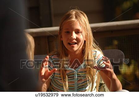 Blond girl gesturing with her hands View Large Photo Image Stock Photo - Blond girl gesturing with her hands. Fotosearch