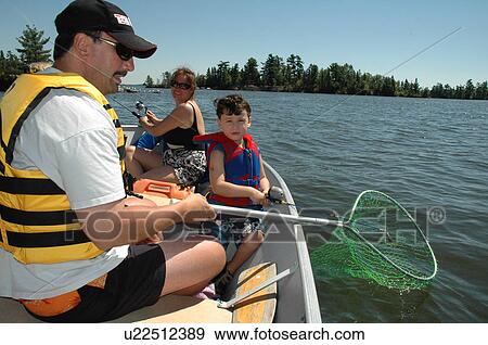 Family fishing in a boat View Large Photo Image Stock Photo - Family fishing in a boat. Fotosearch