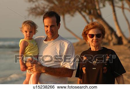 Stock Photograph - Family on Beach - Hawaii. Fotosearch