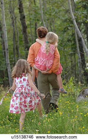 Father giving his daughter a piggyback ride View Large Photo Image Stock Photograph - Father giving his daughter a piggyback ride. Fotosearch
