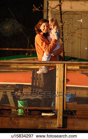 Mother holding child View Large Photo Image Stock Photo - Mother holding child. Fotosearch