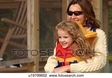 Mother holding her daughter View Large Photo Image Stock Image - Mother holding her daughter. Fotosearch
