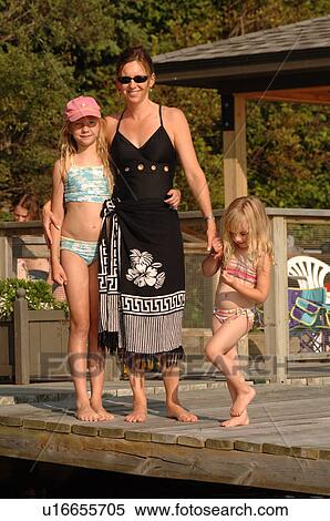 Mother with her daughters on dock View Large Photo Image Stock Photography - Mother with her daughters on dock. Fotosearch