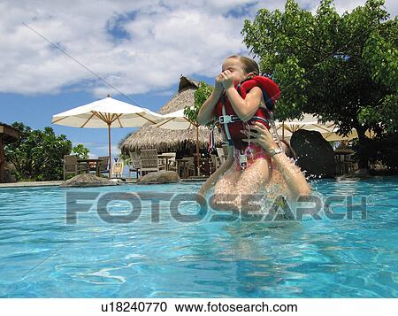 A young girl (12-13) with her father in water View Large Photo Image Stock Image - A young girl (12-13) with her father in water. Fotosearch