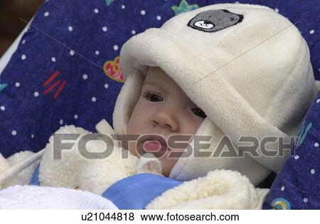 Stock Photo - Baby lying in a pram, Slovenia. Fotosearch