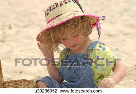 Girl holding hat View Large Photo Image Stock Image - Girl holding hat. Fotosearch