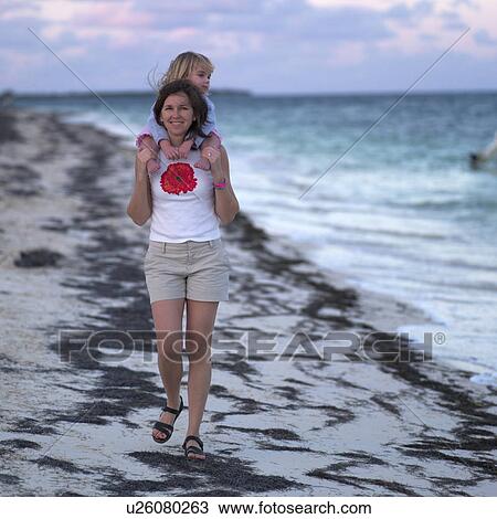 Mother and Daughter on the Beach View Large Photo Image Stock Image - Mother and Daughter on the Beach. Fotosearch