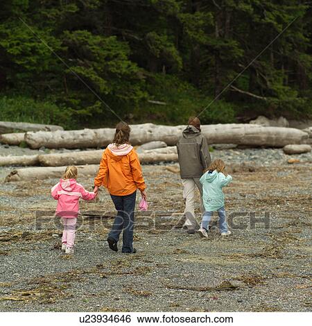 People walking on beach View Large Photo Image Stock Photograph - People walking on beach. Fotosearch