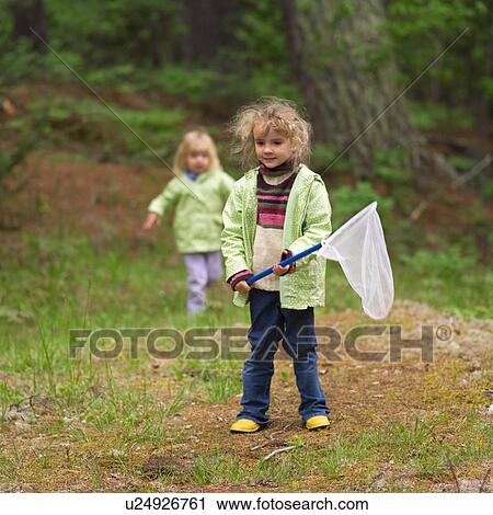Young girl holding a butterfly net View Large Photo Image Stock Image - Young girl holding a butterfly net. Fotosearch