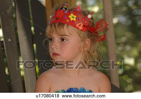 Stock Photo - 4 year old wearing a red headband. Fotosearch