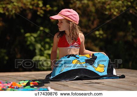 6 year old girl with a towel on her lap View Large Photo Image Stock Photograph - 6 year old girl with a towel on her lap. Fotosearch