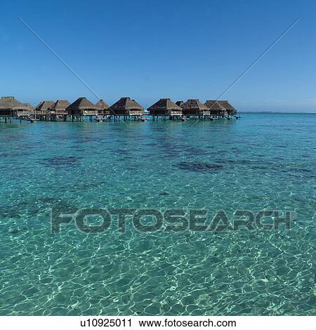 Huts in a Row over Ocean at Moorea in Tahiti View Large Photo Image Stock Image - Huts in a Row over Ocean at Moorea in Tahiti. Fotosearch