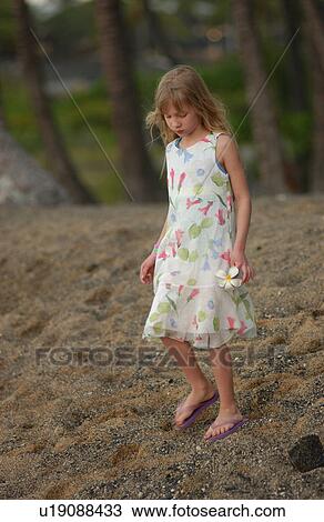 Stock Image - Kids playing on beach. Fotosearch