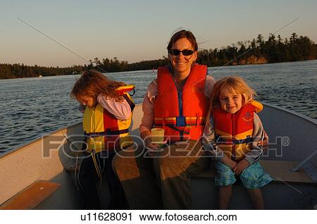 Mother with two girls on boat View Large Photo Image Stock Image - Mother with two girls on boat. Fotosearch