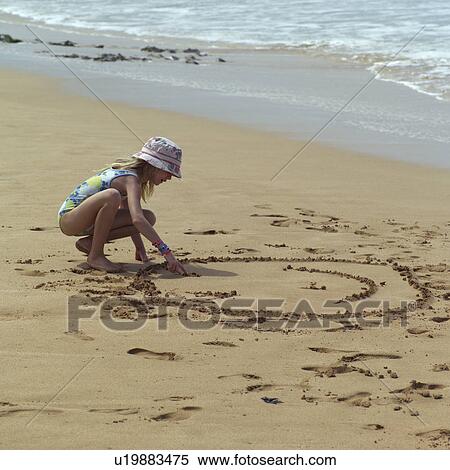 Young Girl Drawing in the Sand View Large Photo Image Stock Photography - Young Girl Drawing in the Sand. Fotosearch
