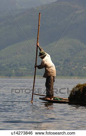 Farmers in row boat View Large Photo Image Stock Photograph - Farmers in row boat. Fotosearch