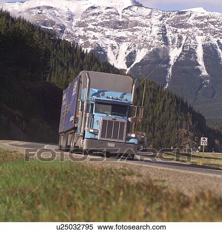 Stock Photography - Semi truck with Rocky mountains in background. Fotosearch