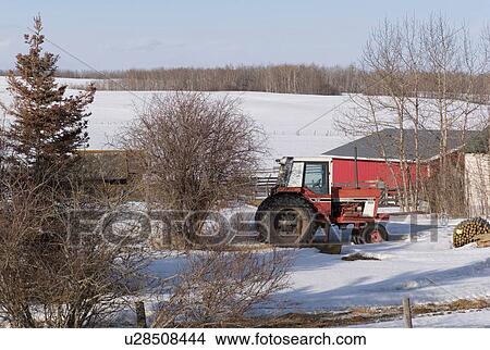Tracktor on farm in Northern Alberta View Large Photo Image Picture - Tracktor on farm in Northern Alberta. Fotosearch