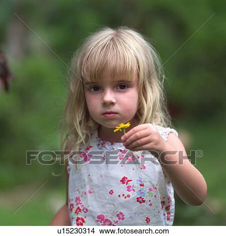 Blond Girl Holding Yellow Flower View Large Photo Image Picture - Blond Girl Holding Yellow Flower. Fotosearch