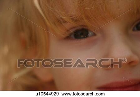Stock Photo - Close-up of a young girl smiling. Fotosearch