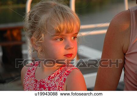 Close-up of a young girl View Large Photo Image Stock Photo - Close-up of a young girl. Fotosearch