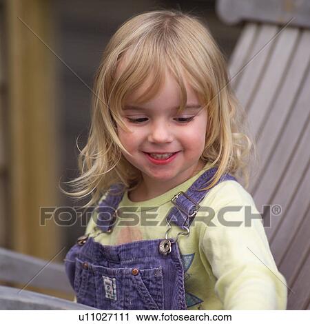 Portrait of a young girl smiling View Large Photo Image Stock Image - Portrait of a young girl smiling. Fotosearch