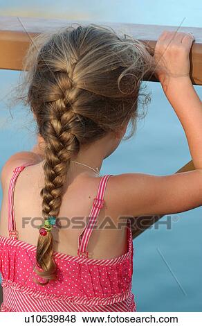 Rear of a young girl View Large Photo Image Stock Photo - Rear of a young girl. Fotosearch