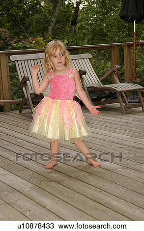 Young girl dancing in a fairy costume View Large Photo Image Stock Image - Young girl dancing in a fairy costume. Fotosearch