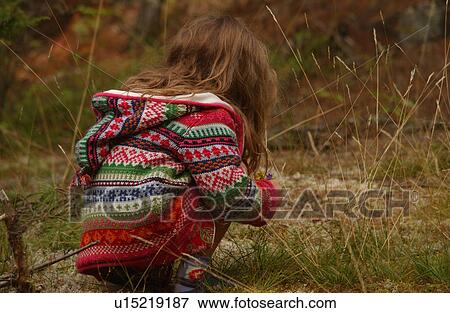 Young girl squatting View Large Photo Image Stock Photo - Young girl squatting. Fotosearch