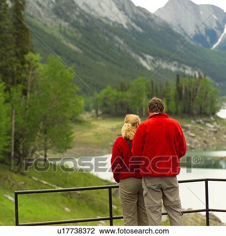 Couple Viewing Rocky Mountain Landscape View Large Photo Image Stock Image - Couple Viewing Rocky Mountain Landscape. Fotosearch