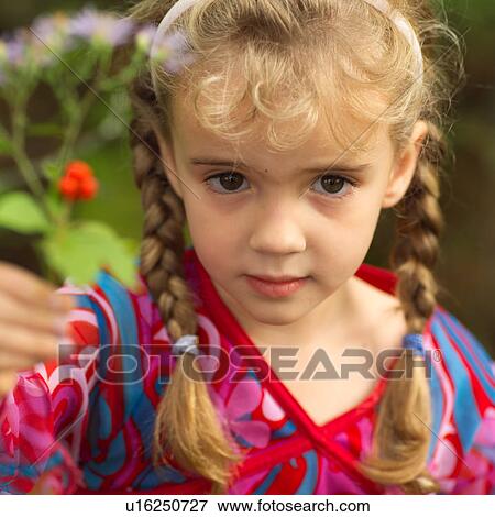 Stock Photo - Girl Holding up Flower. Fotosearch