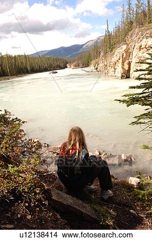 Girl sitting at edge of Medicine Lake View Large Photo Image Picture - Girl sitting at edge of Medicine Lake. Fotosearch