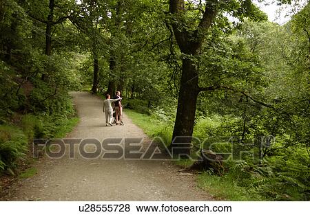 People walking on path in Glendalough View Large Photo Image Stock Photo - People walking on path in Glendalough. Fotosearch