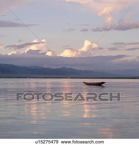 Stock Photo - Boat on Inle Lake. Fotosearch