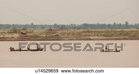 Stock Photo - Boats on the Irrawaddy River. Fotosearch