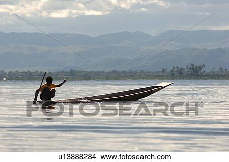 Boy in row boat View Large Photo Image Picture - Boy in row boat. Fotosearch