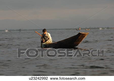 Crouching fisherman View Large Photo Image Stock Image - Crouching fisherman. Fotosearch