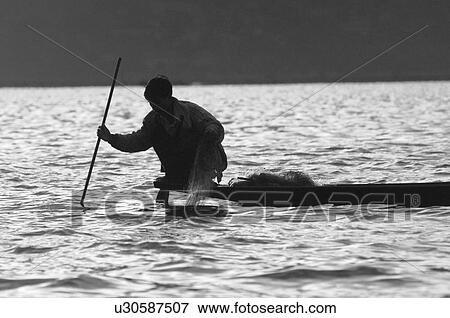 Crouching fisherman View Large Photo Image Stock Photo - Crouching fisherman. Fotosearch