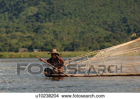 Fisherman in row boat on Inle Lake View Large Photo Image Picture - Fisherman in row boat on Inle Lake. Fotosearch