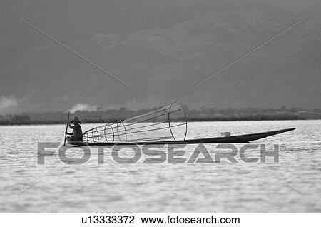 Fisherman in row boat View Large Photo Image Stock Image - Fisherman in row boat. Fotosearch