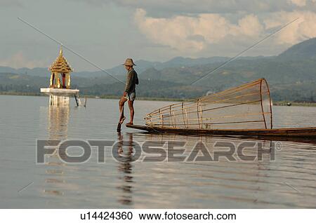 Fisherman in row boat View Large Photo Image Stock Image - Fisherman in row boat. Fotosearch