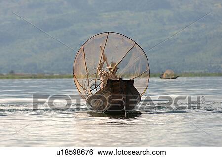 Fisherman in row boat View Large Photo Image Stock Photograph - Fisherman in row boat. Fotosearch