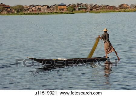Fisherman leg rowing View Large Photo Image Stock Image - Fisherman leg rowing. Fotosearch