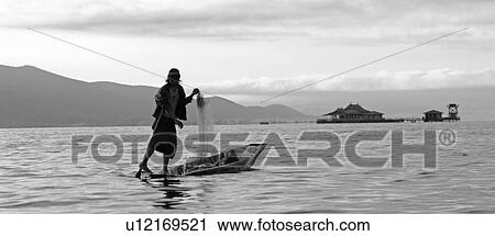 Fisherman leg rowing View Large Photo Image Stock Image - Fisherman leg rowing. Fotosearch