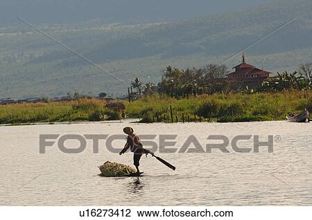 Fisherman leg rowing View Large Photo Image Stock Image - Fisherman leg rowing. Fotosearch