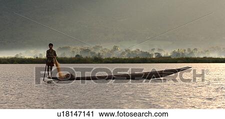 Fisherman leg rowing View Large Photo Image Stock Image - Fisherman leg rowing. Fotosearch