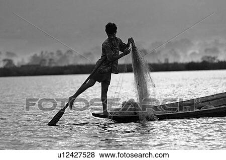 Stock Photo - Fisherman leg rowing. Fotosearch