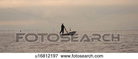 Fisherman leg rowing View Large Photo Image Stock Photo - Fisherman leg rowing. Fotosearch